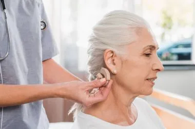 1704833520 depositphotos 167624266 stock photo nurse and patient with hearing